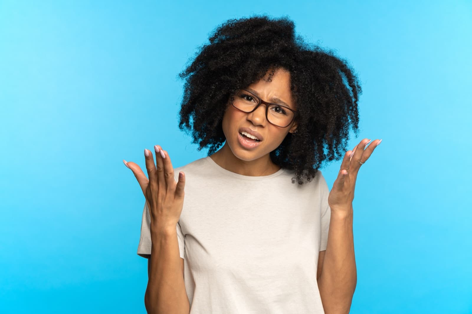 A customer with a frustrated expression and gesturing hands — the moment before a contested claim escalates.